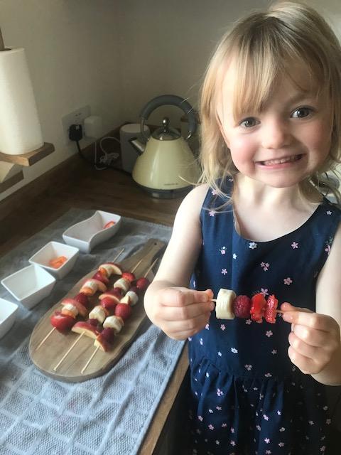Evie made a fruit kebab for each of her family